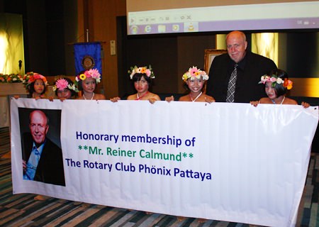 Young dancers from the Pattaya Orphanage congratulate Rotary Phoenix-Pattaya’s newest honorary member, Reiner Calmund.