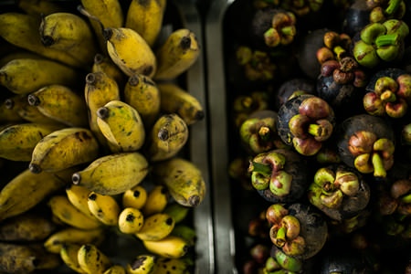 Bananas are available all year round, while mangosteens are in season from May to October.