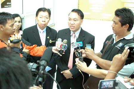 Pattaya Chief Justice Apichart Thepnoo (center) addresses the press after handing down a ruling of 2.3 million baht compensation for each death to the families of two Chinese tourists killed in last month’s speedboat accident off Bali Hai Pier, a little less than a third of what they asked for.