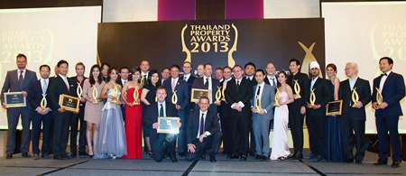 The award winners at the 2013 Thailand Property Awards pose for a group photo on stage at the conclusion of the Gala Awards Dinner at the Centara Grand & Bangkok Convention Center, Thursday, Sept. 19.