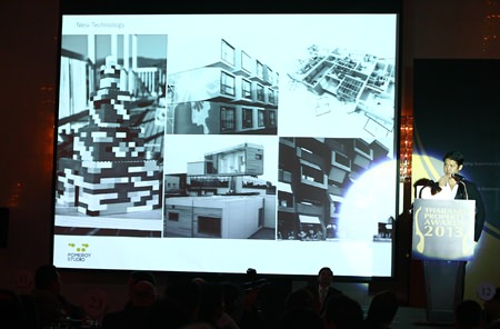 Professor Jason Pomeroy (standing bottom right) displays some innovative designs for energy saving homes of the future during his keynote speech.