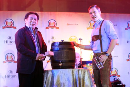 Loud cheers of “O’zapft is!” filled the beer hall as Chanyuth Hengtrakul, Secretary to the Minister of Education taps the first beer keg.