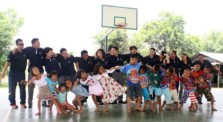 The Hilton staff and young dancers enjoy a fun dance.