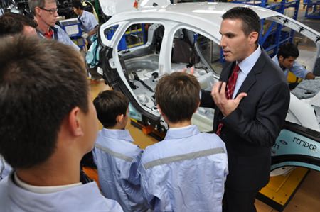 Todd Barber of Ford Motor Company provides Regent’s students with a detailed tour of the assembly plant.