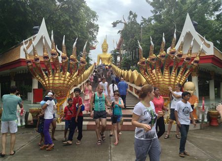 Citizens and Thai and foreign tourists pay their respects to Lord Buddha and make merit at Wat Khao Phra Yai on Pratamnak Hill.