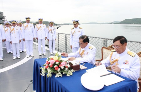 Vice Adm. Phijan Theeranet and Adm. Khanat Thongphun sign the necessary documents aboard the HTMS Kraburi, turning over command of the Royal Thai Fleet to Vice Adm. Phijan Theeranet.
