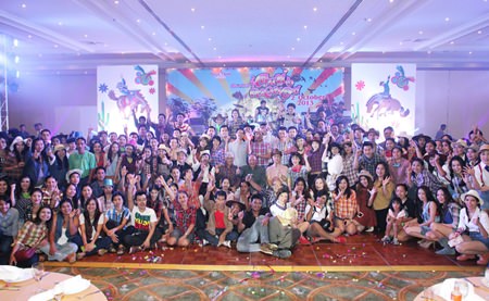 Employees and Dusit Thani administrators pose for a picture during the staff party.