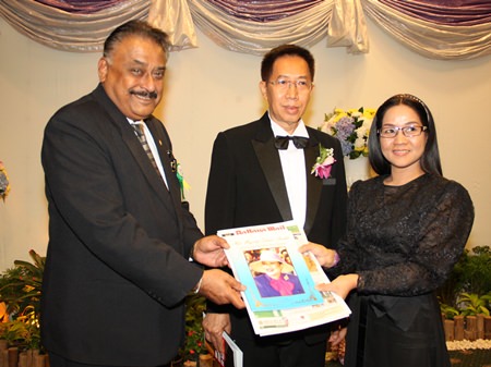 Peter Malhotra (left) and Suthasinee Maneekul (right) present commemorative books to Chao Pakinai Na Chiang Mai.