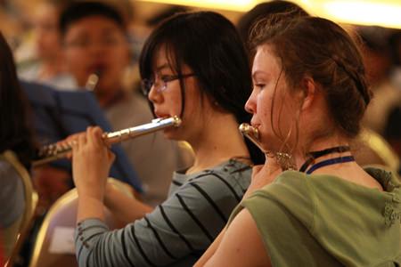 Two of GIS’s talented musicians play the flute during rehearsals.