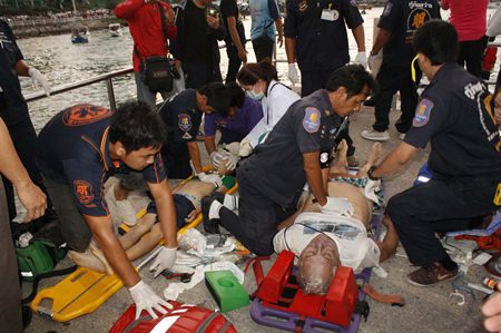 Emergency Medical Technicians frantically provide CPR to try and save the victims.