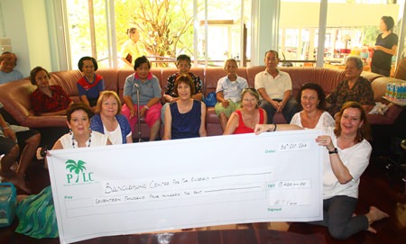 The PILC formerly present a cheque valued at 17,400 Thai Baht to the Banglamung Home for the Elderly for assistance in purchasing two washing machines.