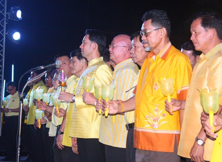 Mayor Itthiphol Kunplome leads city councilors in the candlelight ceremony.