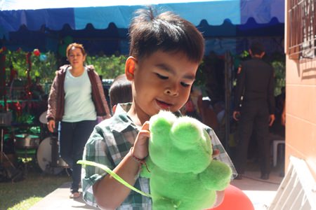 This little one received a stuffed animal as a reward for his stage performance.