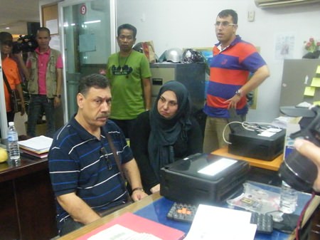 (Seated) Isa Atsan and Melaken Parsa have been arrested for grifting their countryman out of US$800.