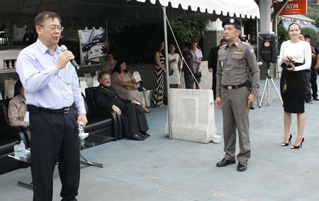 Deputy Prime Minister Yukol Limamthong addresses a gathering of police officials and expats before beginning his inspections of local watercraft.
