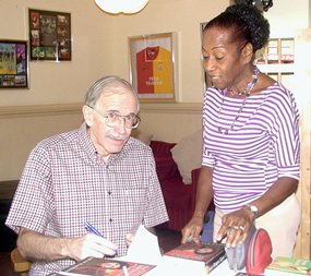 Dean autographs a copy of ‘Thomas Rowley’ for lucky PCEC member Janet Smith.