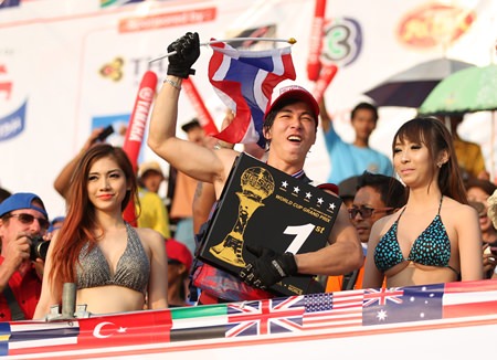 Songwut Lappasappaisan (centre) celebrates after winning a King’s Cup for Thailand in the Pro Freestyle event.
