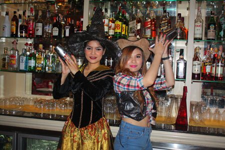 The Witch and Cowgirl serve cocktails at Mata Hari.