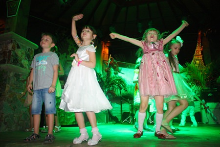 Children dance at the Centara Grand Mirage Beach Resort Pattaya.