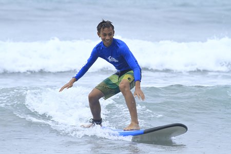 Students take to the waves off the coast of Bali.