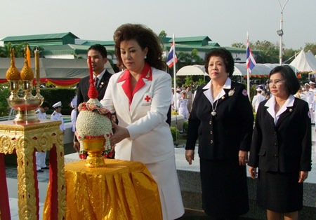 Chonburi Red Cross chief Busarawadee Ekachai lays flower ornaments to pay homage to King Naresuan on Thai Armed Forces Day.
