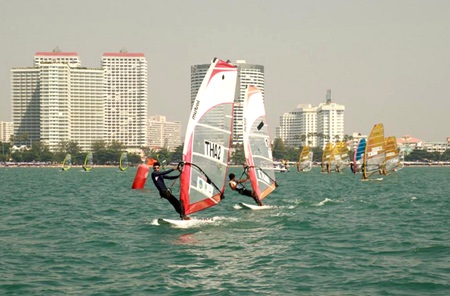 A reduced fleet takes to the water Jan. 10 in Jomtien for the Pattaya International Windsurfing Competition.