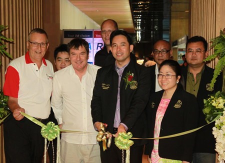 Pattaya mayor Ittipol Khunplome (center right) and Charlie Warner, CEO of Exact Trading Company (center left), preside over the official opening of the 2014 Pattaya Property Show at the Hilton Pattaya hotel, Friday, Jan. 9.