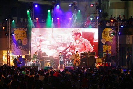 The Somkiat band from the Small Room label performs for fans on the blue stage at Central Festival Pattaya Beach.