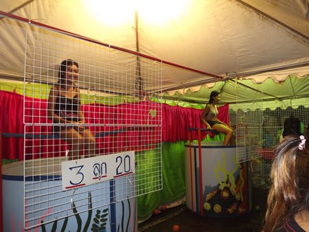 Step right up! Hit the target and watch the poor girl fall into the water barrel. Three chances for 20 baht.