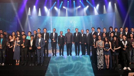 Event VIPs and guests of honor take to the stage with the award winners after the awards ceremony of the 23rd Suppanahongsa Awards at PEACH.