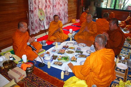 Diana Group staff offers lunch to the monks.
