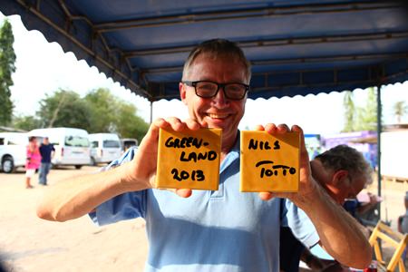 Totto Befring shows off two of the signed tiles at Baan Jing Jai. (Photo: Dujdao Udomsin)