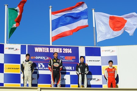 The Thai flag flies high as Sandy Stuvik stands atop the podium at the Paul Ricard circuit in southern France, Saturday, March 1.