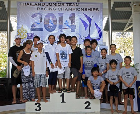 The top three teams representing Bangkok Patana School, Bangkok Prep and Regents International School Pattaya pose on the podium during the prize-giving ceremony.