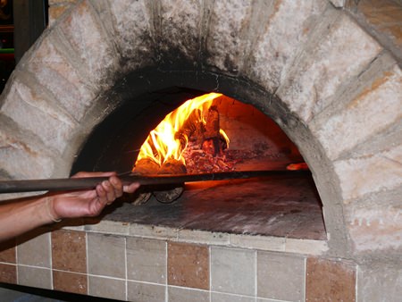 Andrea not only makes the pizzas, he also makes the pizza oven they are cooked in.