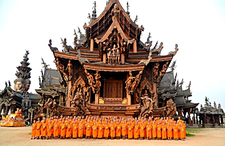 Over a hundred monks prepare to lead a parade throughout the greater Naklua, Pattaya and Jomtien areas so that people could sprinkle holy water on Buddhist relics from the Sanctuary of Truth.  The relics were put on a special float (back, left) to give residents and tourists an opportunity to pour holy water on the relics on Songkran Day.