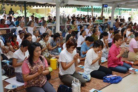 Citizens listen to sermons and receive blessings from monks.
