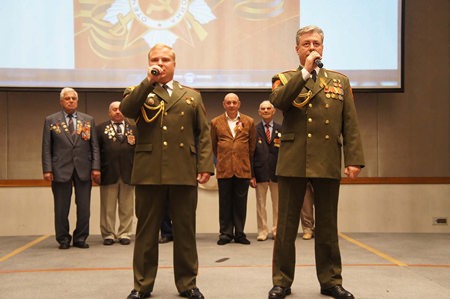 Russians sing their national anthem to celebrate the 69th anniversary of Victory Day.