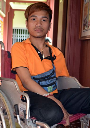 Eighteen year old Man, with his new wheelchair.