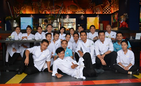 The hard working chef & kitchen team pose for a photo after finishing the preparations.