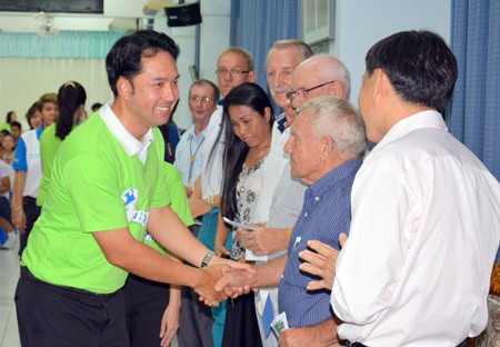 Mayor Itthiphol Kunplome shakes Bernie Tuppin’s hand, thanking him and other PSC Charity members for their support.