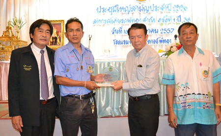 Plaques were presented to Nakhon Srinob and Winai Amcharoen, two co-op members who found, and returned, large amounts of cash left behind by tourists.