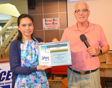 PCEC’s MC Richard Silverberg presents Pensiri with a Certificate of Appreciation for her presentation.