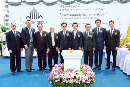 Country Group Development directors and executives pose for a photo during the merit making and stone laying ceremony for the Landmark Waterfront project in Bangkok, June 23.