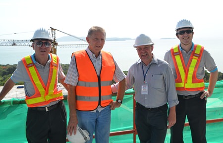 From left: Nigel Cornick, CEO of Kingdom Property; Trever Antony, Development Director, Kingdom Property; Paul Strachan of Pattaya Mail Media Group; and David Johnson, Managing Director of Delivering Asia Communications, pose at the Southpoint construction site.