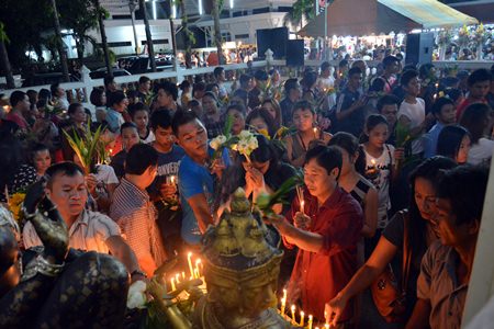 Citizens present candles and flowers in hopes they and their families will prosper.