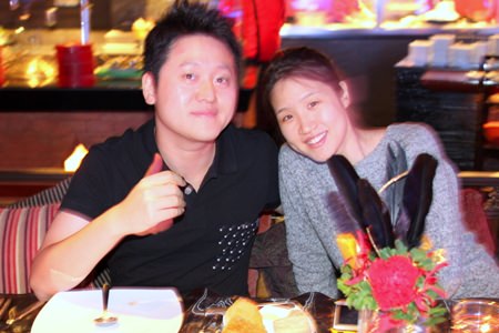 A sweet couple from Korea having a holiday in Pattaya and are enjoying the music.