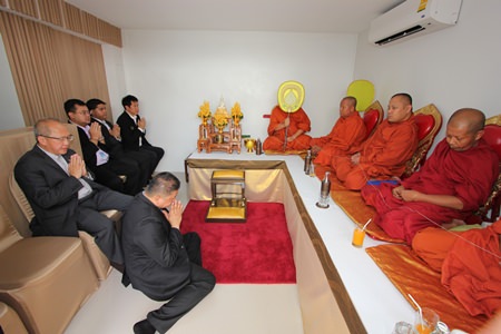 Buddhist monks perform religious ceremonies to sanctify the new Swedish Consulate.