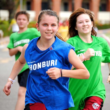 Students smile as they reach the finish line.