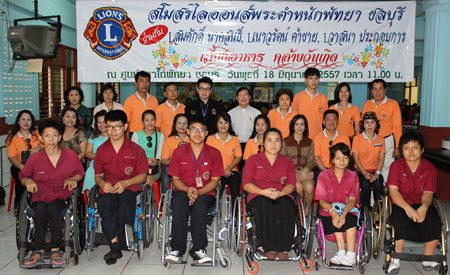 Lions Club Pratamnak Pattaya-Chonburi club secretary Somsak Naksonthi, along with Naowarath Khakhai and Wasana Prakobkarn pose for a commemorative photo after serving lunch to 300 students at the Redemptorist Vocational School for People with Disabilities.